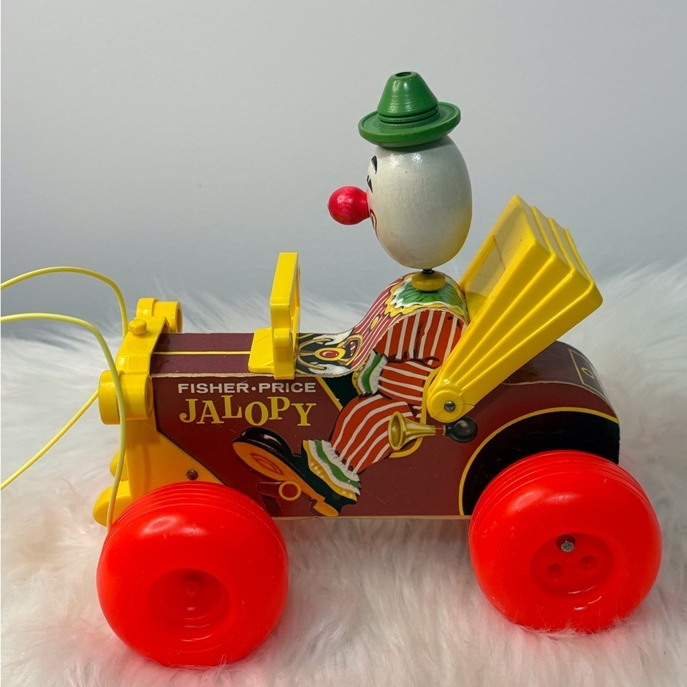 (189)Fisher-Price Jalopy Clown Toy with Red and Yellow Accents